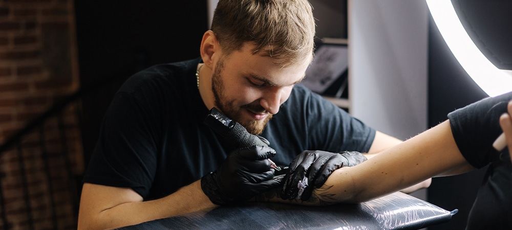 tattoo artist tattooing