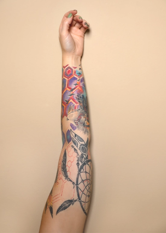 geometric black and grey vs color tattoo