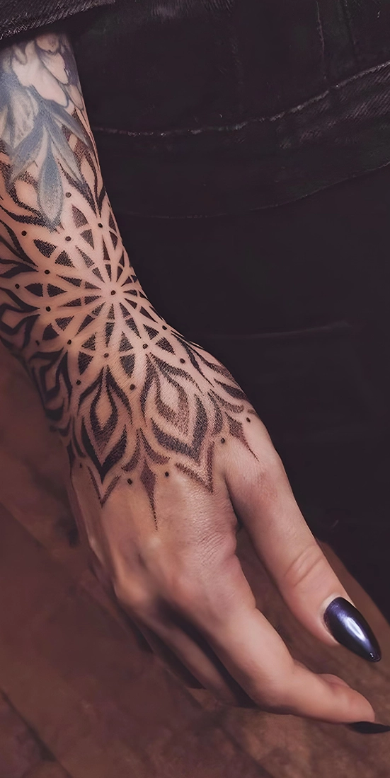 geometric style tattoo on hand