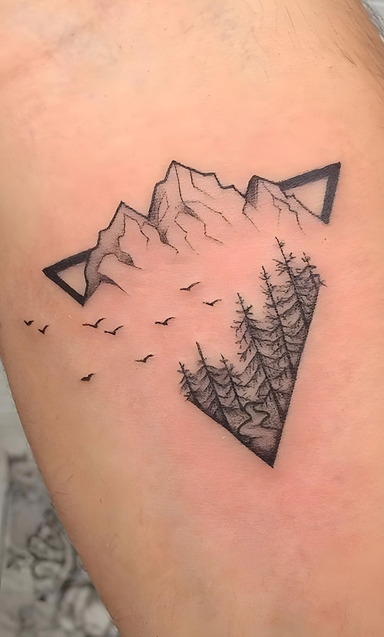 mountain and geometric tattoo