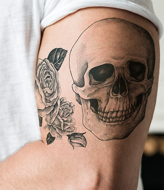 skull and flower black theme tattoo