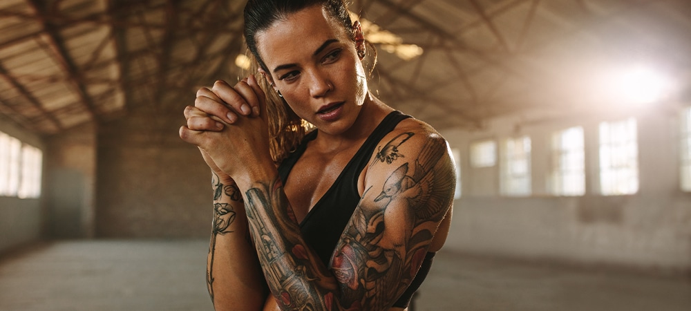 athlete women full arm tattoo