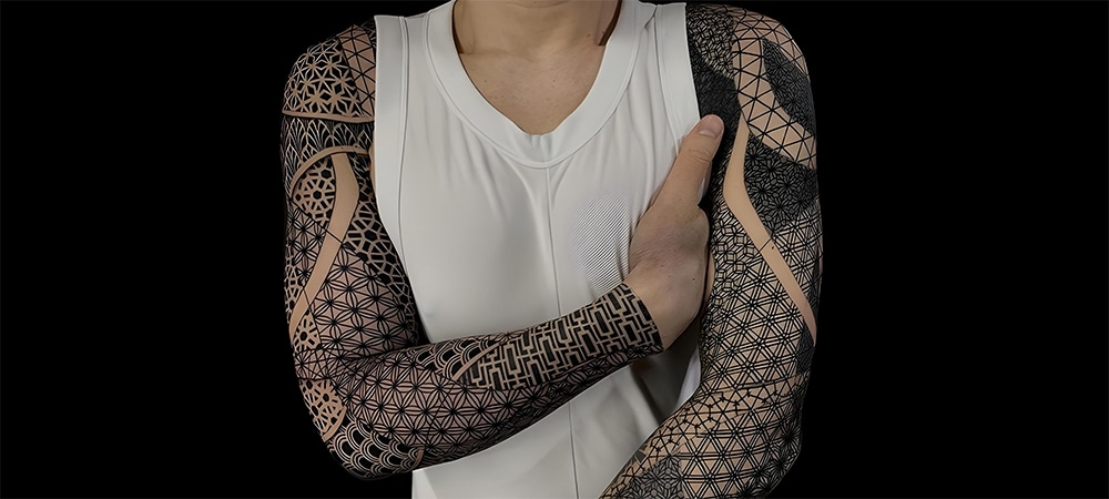 geometric design full arm tattoo on men