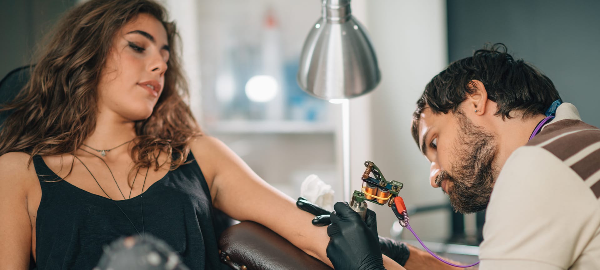 girl getting first time tattoo